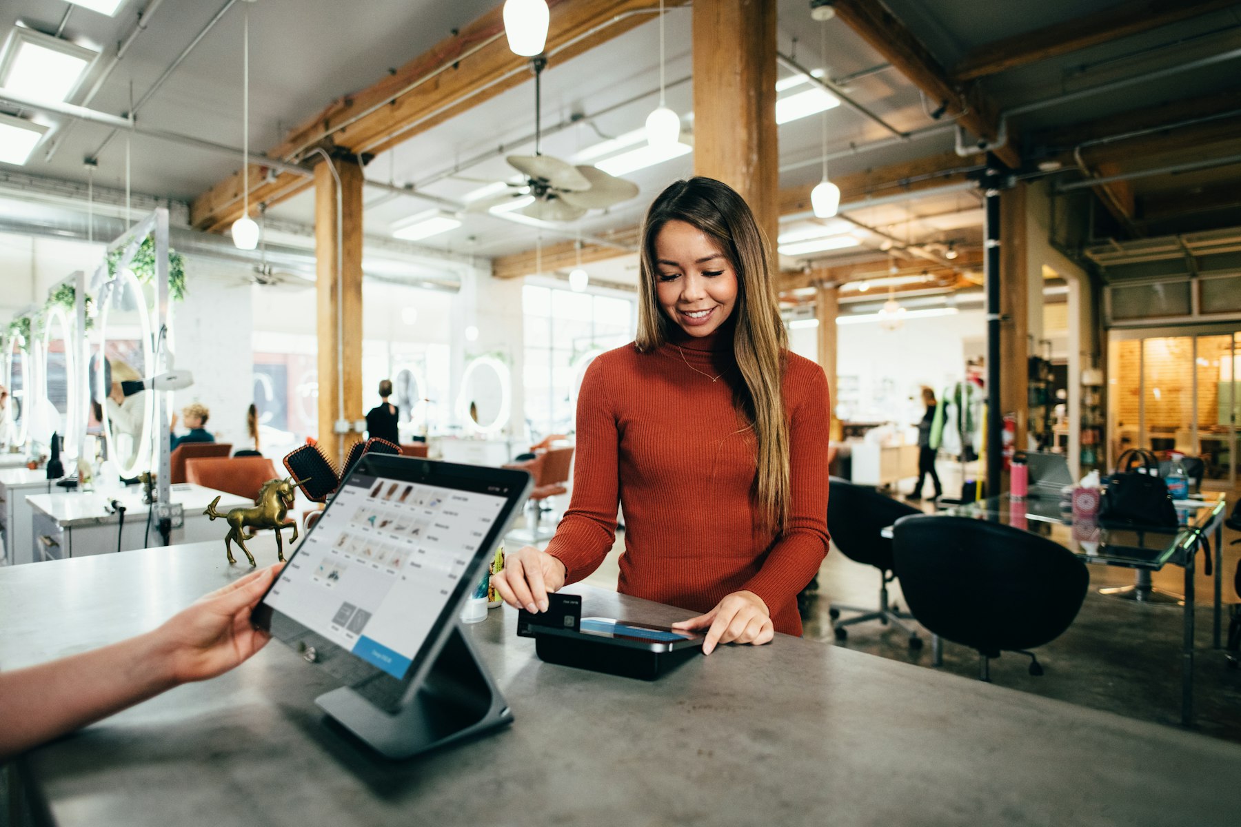 A business owner serving a customer